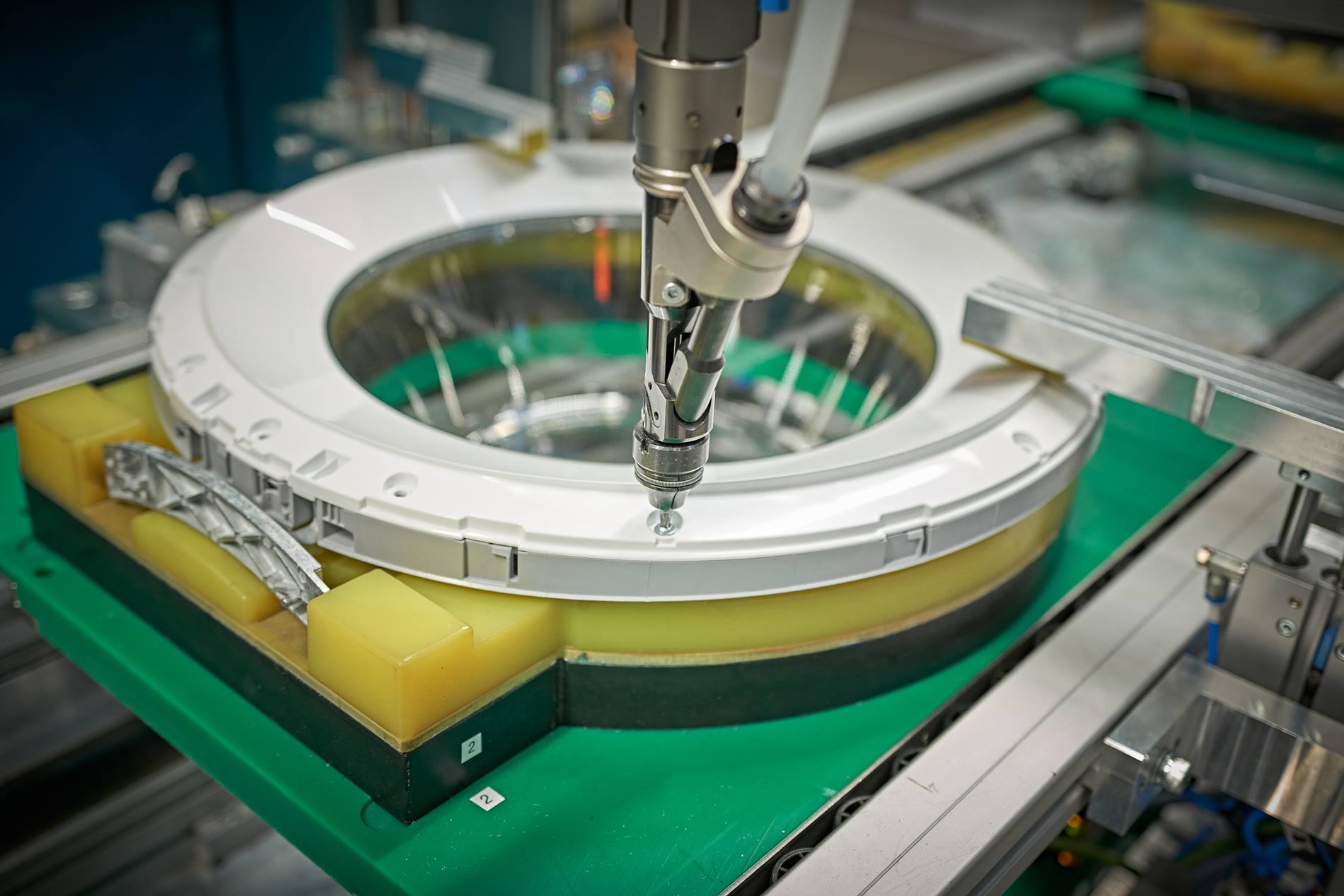 When robot screwing in motion, the elements are installed while they move along the conveyor system