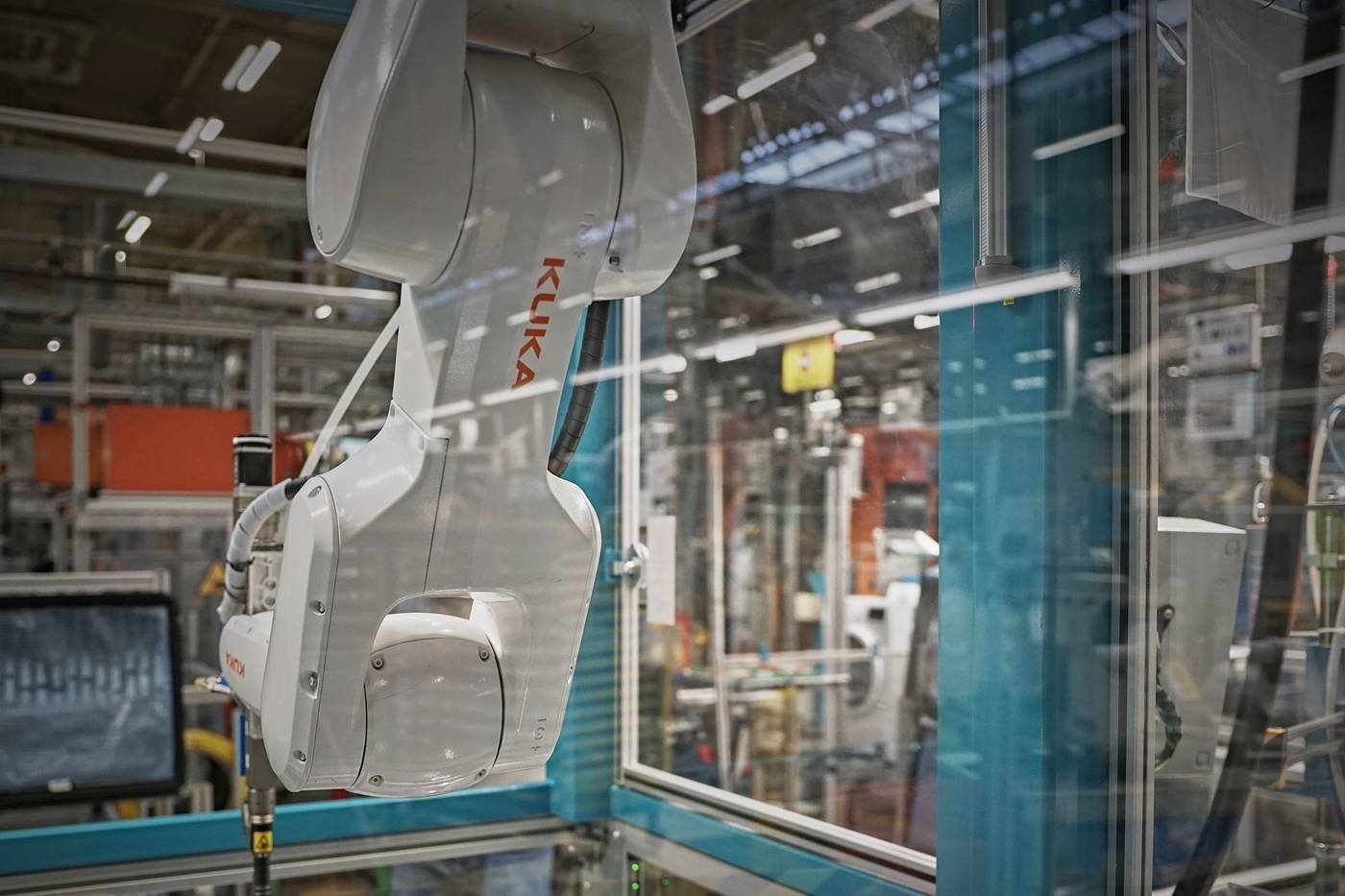 The KR AGILUS screwdriving robot in action: screwing together washing machine elements